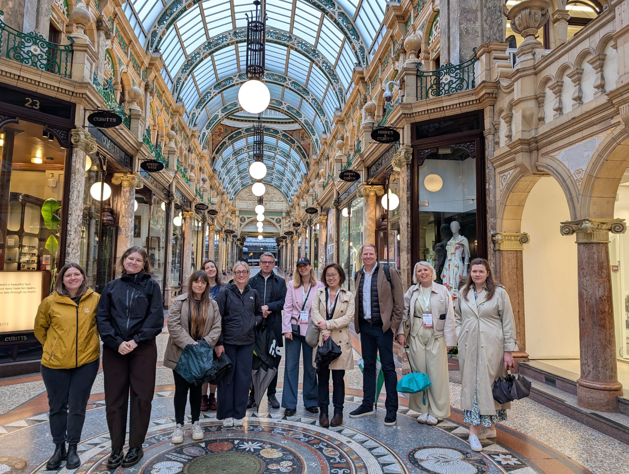 A group of people stood inside Leeds. County Arcade