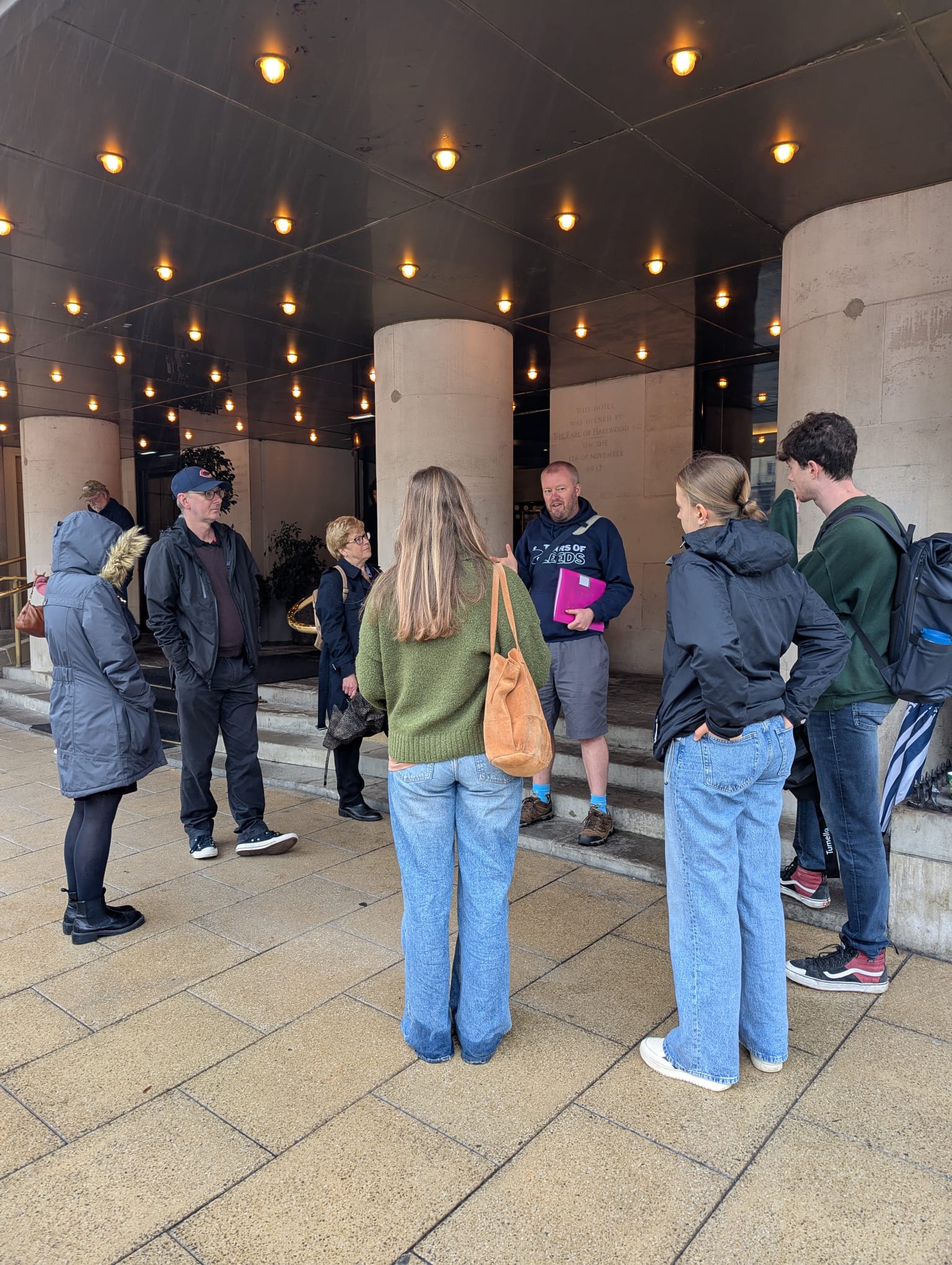 A tour group outisde the Queen's Hotel in Leeds